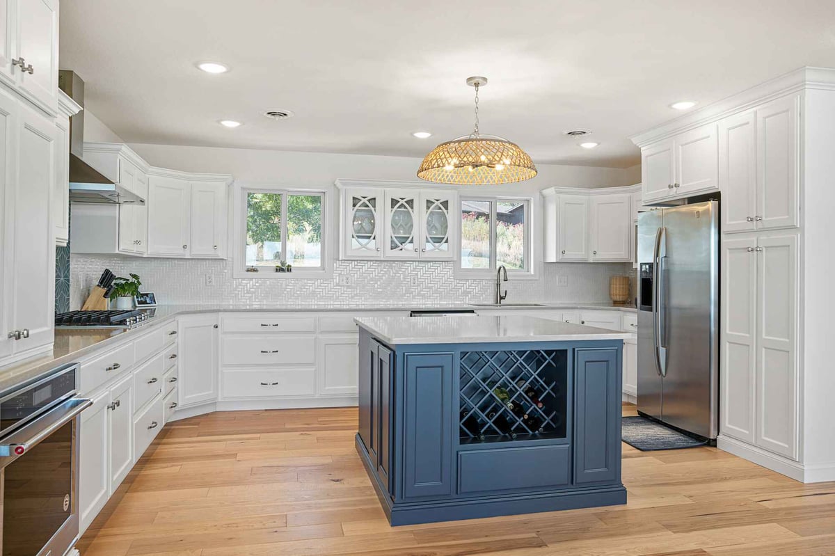 kitchen remodel with hanging light over kitchen island