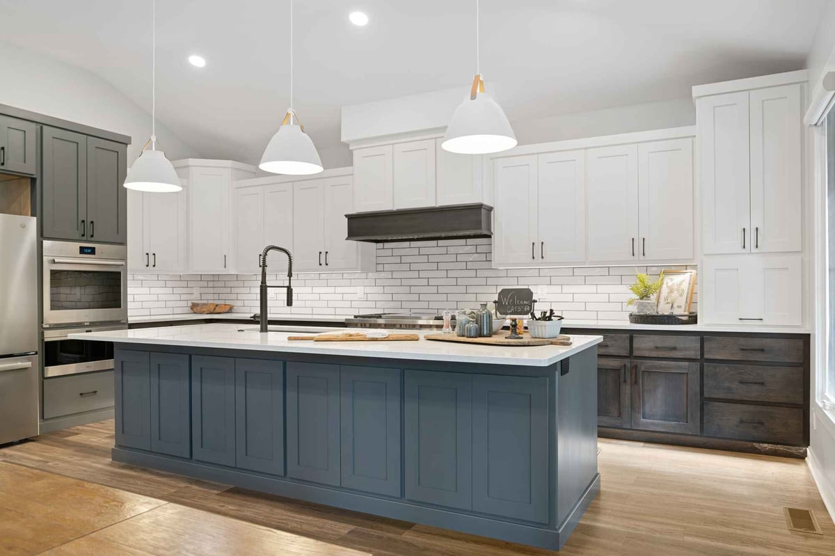kitchen remodel with white countertops and blue cabinets