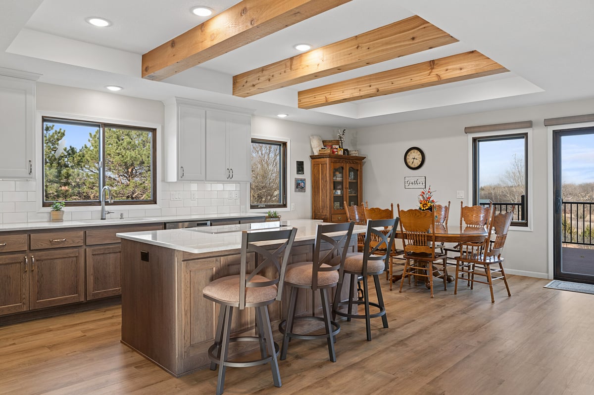 kitchen remodel with dark cabinets and wood ceiling beams