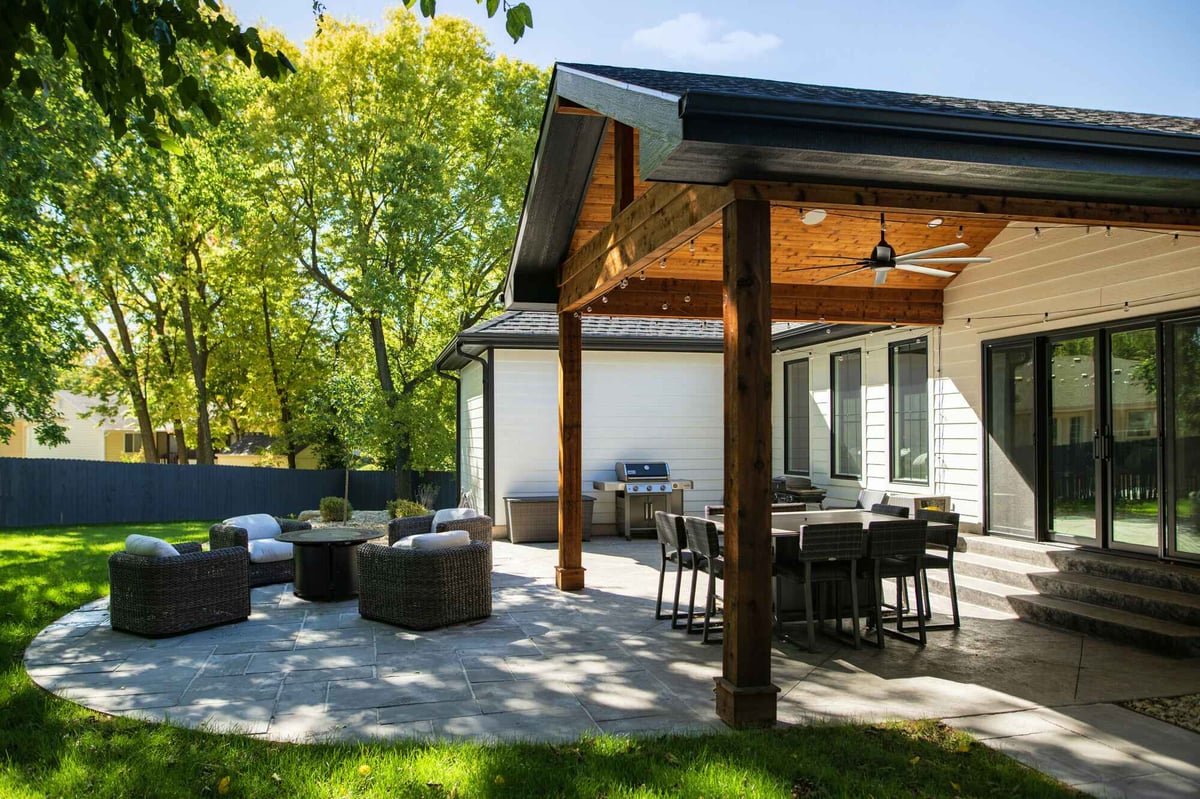 outdoor patio addition with overhang and wood ceiling
